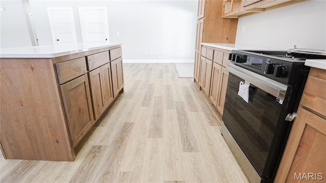 20167 County Road 7300, Newburg, MO 65560 - kitchen with stainless steel range, light wood-style floors, and light countertops