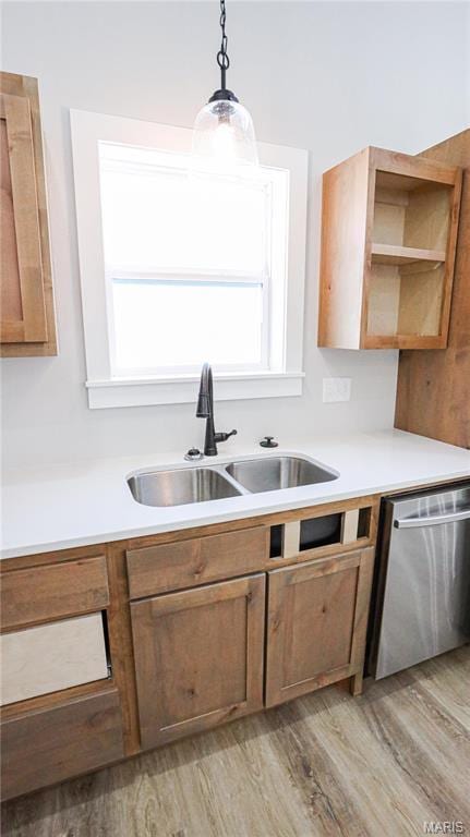20167 County Road 7300, Newburg, MO 65560 - kitchen with a sink, dishwasher, light wood-style floors, and pendant lighting