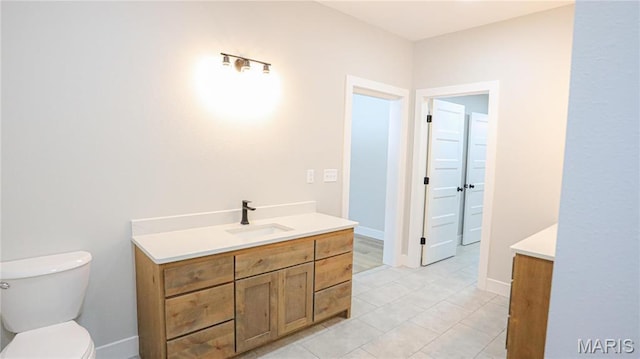 20167 County Road 7300, Newburg, MO 65560 - bathroom with vanity, toilet, and tile patterned flooring