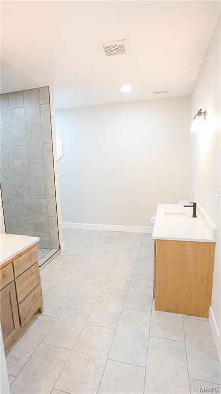 20167 County Road 7300, Newburg, MO 65560 - full bath with vanity, tile patterned flooring, tiled shower, recessed lighting, and baseboards