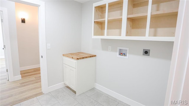 20167 County Road 7300, Newburg, MO 65560 - laundry area featuring washer hookup, electric dryer hookup, baseboards, and light tile patterned floors