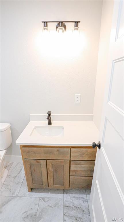 20167 County Road 7300, Newburg, MO 65560 - half bathroom with marble look tile flooring, vanity, and toilet