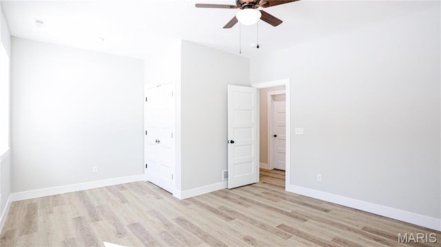 20167 County Road 7300, Newburg, MO 65560 - unfurnished bedroom with wood finished floors, baseboards, and a ceiling fan