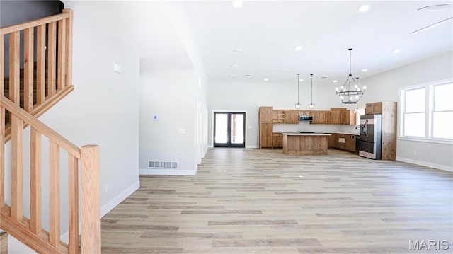20167 County Road 7300, Newburg, MO 65560 - kitchen featuring open floor plan, light wood-type flooring, baseboards, light countertops, and recessed lighting