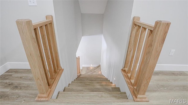 20167 County Road 7300, Newburg, MO 65560 - stairway featuring wood finished floors and baseboards
