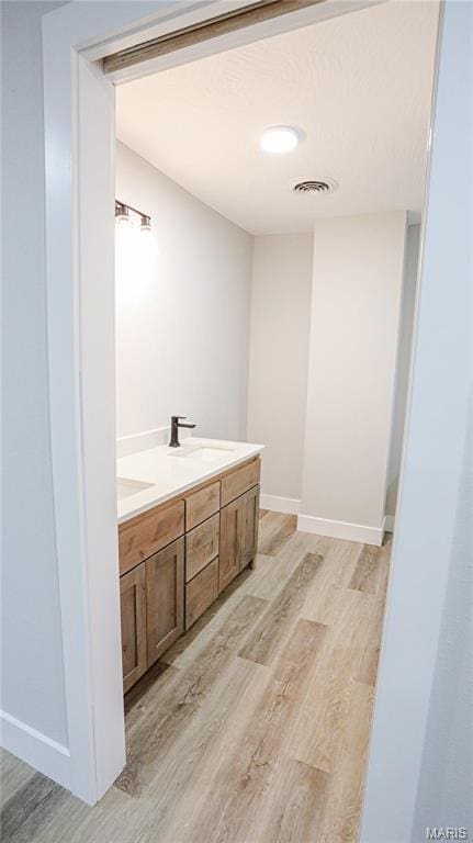 20167 County Road 7300, Newburg, MO 65560 - bathroom with wood finished floors and double vanity
