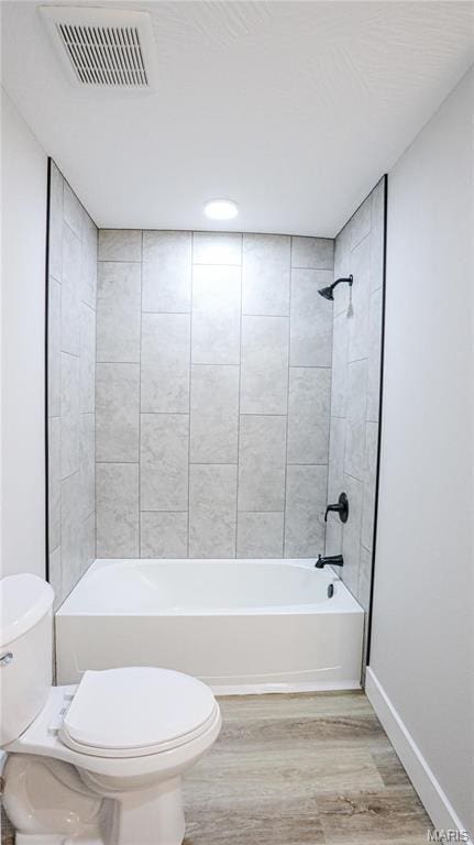 20167 County Road 7300, Newburg, MO 65560 - bathroom featuring toilet, wood finished floors, bathtub / shower combination, and baseboards