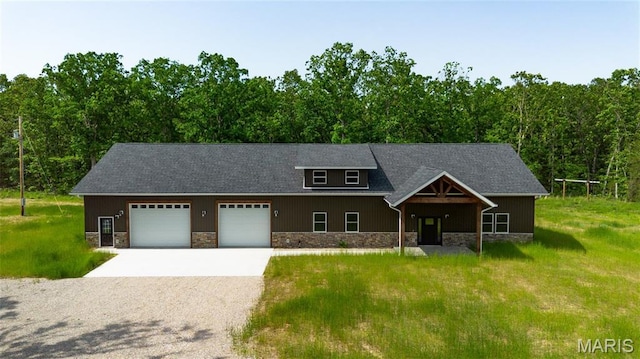 20167 County Road 7300, Newburg, MO 65560 - view of front of property with stone siding, driveway, an attached garage, and a front yard