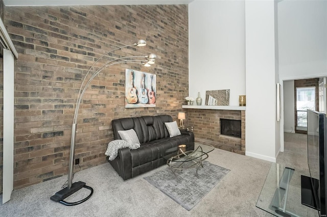 632 Coeur De Royale Dr Unit C, Saint Louis, MO 63141 - living room featuring carpet flooring, brick wall, a brick fireplace, a high ceiling, and baseboards
