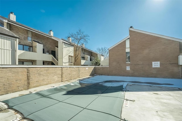 632 Coeur De Royale Dr Unit C, Saint Louis, MO 63141 - view of swimming pool featuring fence and a covered pool