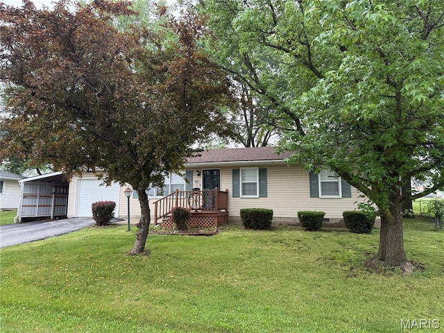 15 W Bibb Dr, Bowling Green, MO 63334 - view of front of property featuring a carport, a front yard, and driveway