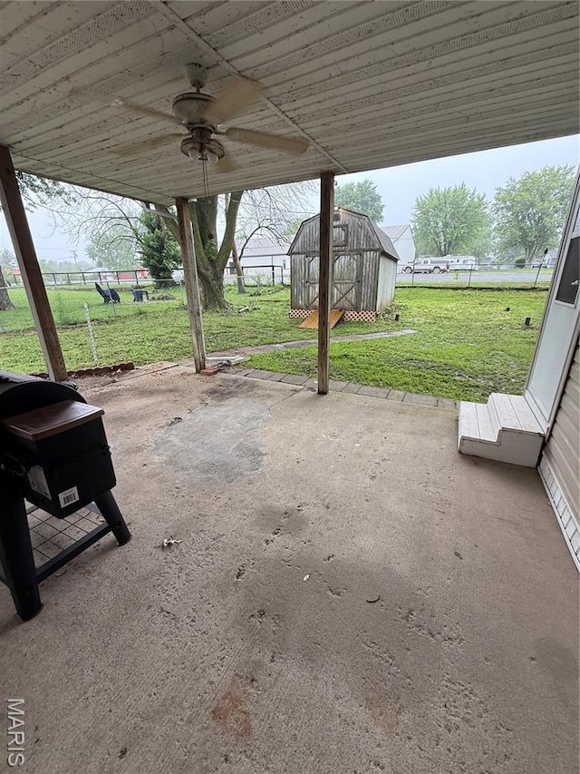 15 W Bibb Dr, Bowling Green, MO 63334 - view of patio / terrace with ceiling fan and an outbuilding