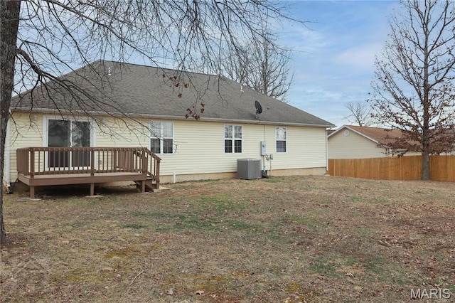 20981 Lacombe Rd, Waynesville, MO 65583 - rear view of property featuring a wooden deck, roof with shingles, and central AC unit