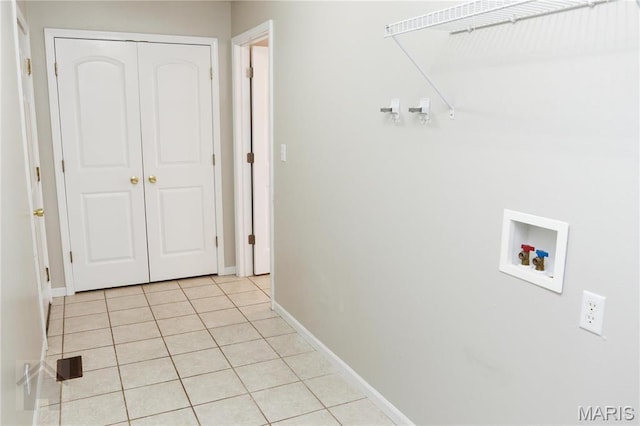 20981 Lacombe Rd, Waynesville, MO 65583 - washroom with hookup for a washing machine, light tile patterned floors, and baseboards