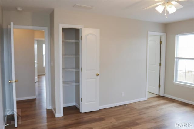20981 Lacombe Rd, Waynesville, MO 65583 - unfurnished bedroom featuring wood finished floors and baseboards