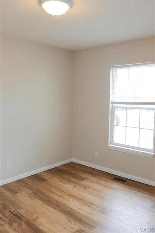 20981 Lacombe Rd, Waynesville, MO 65583 - unfurnished room featuring light wood-type flooring and baseboards