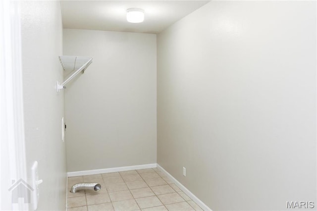 20981 Lacombe Rd, Waynesville, MO 65583 - laundry room featuring light tile patterned floors and baseboards