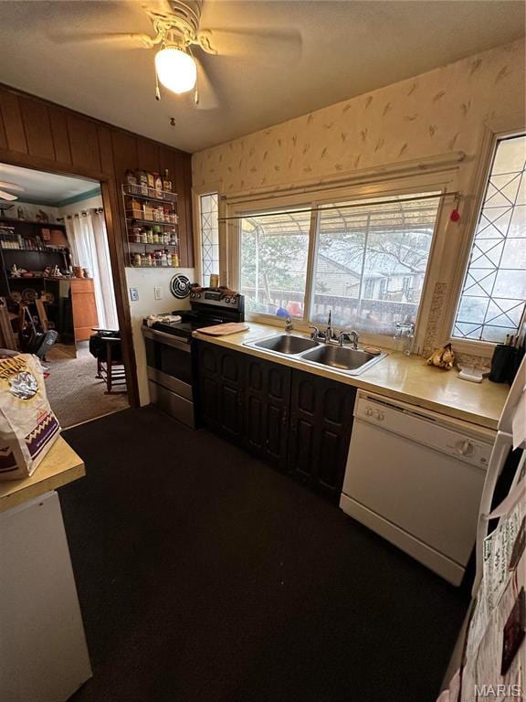 4290 Chateau De Ville Dr Unit G, Saint Louis, MO 63129 - kitchen featuring a sink, stainless steel electric stove, dishwasher, wallpapered walls, and light countertops
