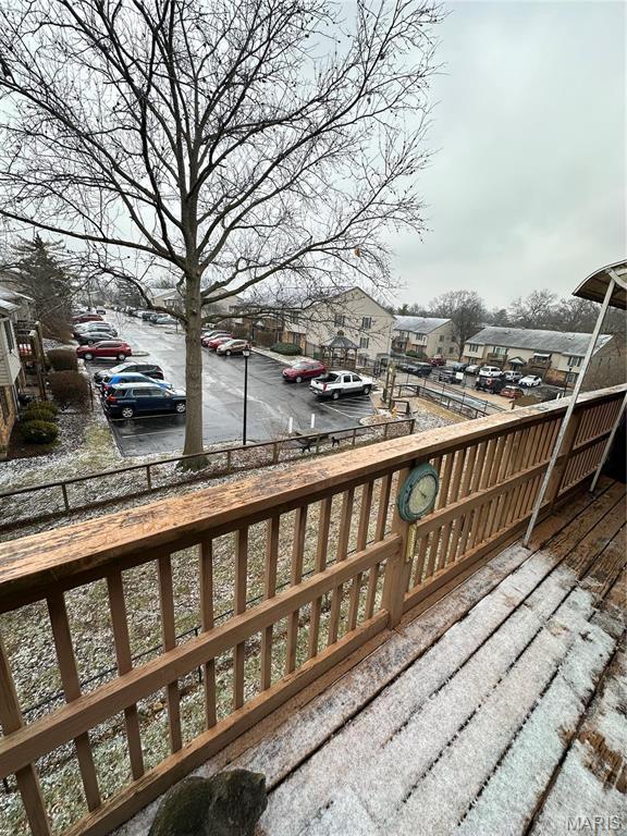 4290 Chateau De Ville Dr Unit G, Saint Louis, MO 63129 - wooden terrace with a residential view