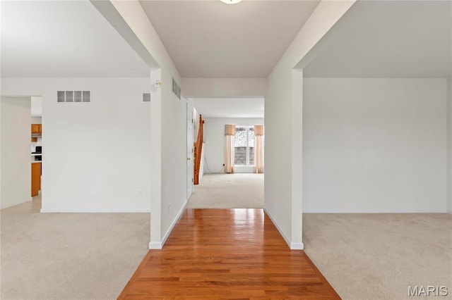 1 Ashbury Crossing Ct, Florissant, MO 63034 - hallway featuring light carpet and baseboards