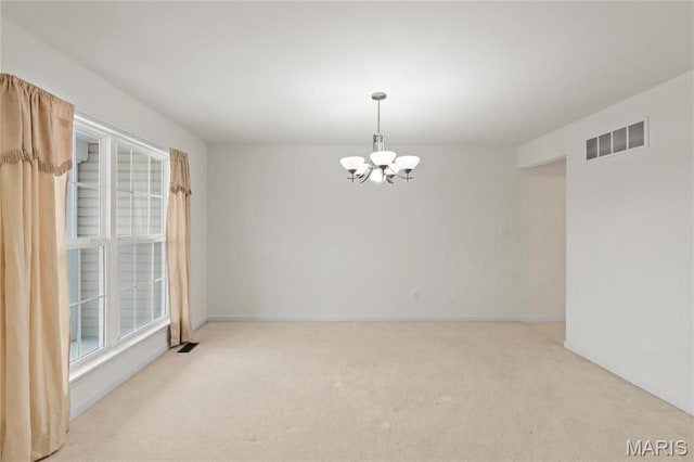 1 Ashbury Crossing Ct, Florissant, MO 63034 - spare room featuring a chandelier, carpet flooring, and baseboards