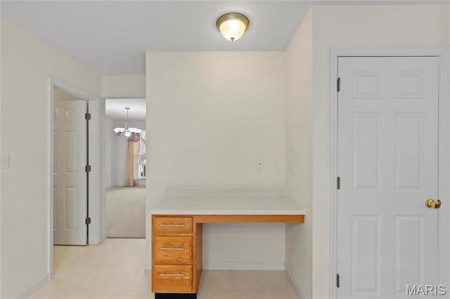 1 Ashbury Crossing Ct, Florissant, MO 63034 - hall featuring an office area, a chandelier, and baseboards