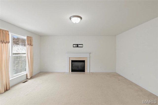 1 Ashbury Crossing Ct, Florissant, MO 63034 - unfurnished living room with a fireplace with flush hearth and carpet