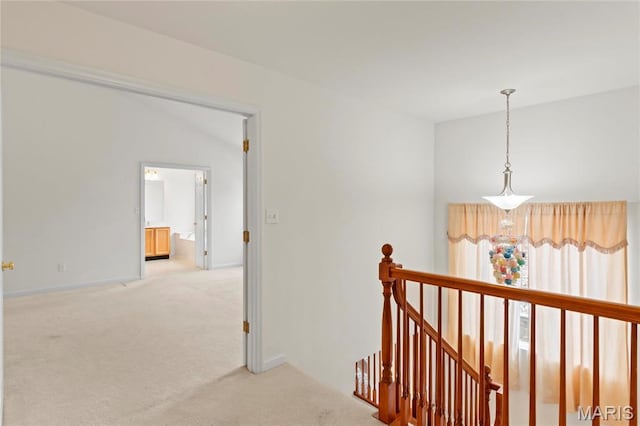 1 Ashbury Crossing Ct, Florissant, MO 63034 - corridor featuring an upstairs landing, light carpet, and baseboards