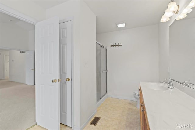 1 Ashbury Crossing Ct, Florissant, MO 63034 - full bathroom featuring a stall shower, vanity, toilet, and baseboards