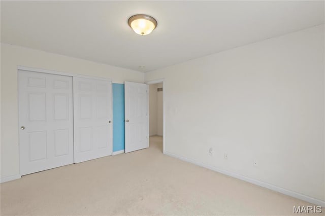 1 Ashbury Crossing Ct, Florissant, MO 63034 - unfurnished bedroom with carpet floors, baseboards, and a closet