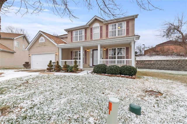 1 Ashbury Crossing Ct, Florissant, MO 63034 - traditional-style home with covered porch, an attached garage, and concrete driveway
