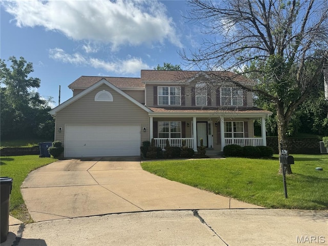 1 Ashbury Crossing Ct, Florissant, MO 63034 - traditional-style house featuring a porch, driveway, a front yard, and a garage