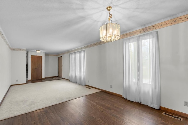 2013 Lee Dr, Cape Girardeau, MO 63701 - unfurnished room with a chandelier, baseboards, crown molding, and wood finished floors