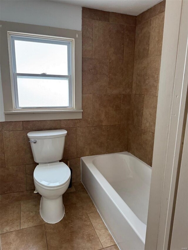 1355 Springfield Rd, Lebanon, MO 65536 - full bath with toilet, a tub to relax in, tile patterned flooring, and tile walls