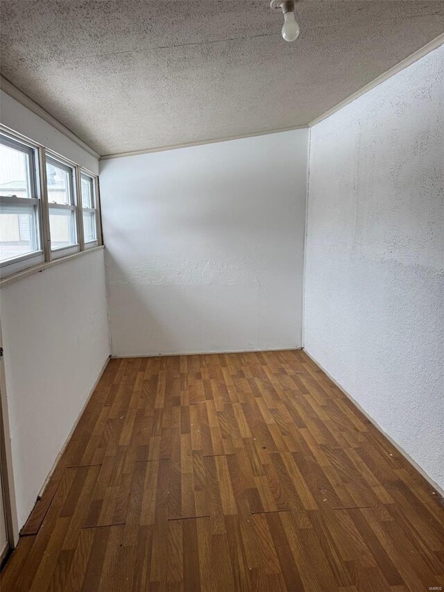 1355 Springfield Rd, Lebanon, MO 65536 - unfurnished room with wood finished floors and a textured ceiling
