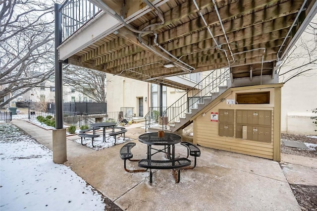 1523 S 10th St Unit 207, Saint Louis, MO 63101 - view of patio / terrace featuring mail area, stairway, and fence