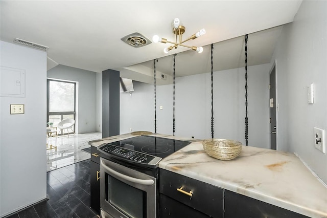 1523 S 10th St Unit 207, Saint Louis, MO 63101 - kitchen with stainless steel electric range oven and dark cabinetry