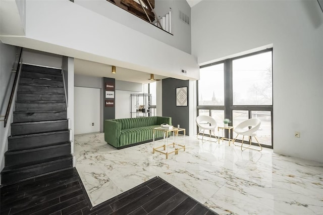 1523 S 10th St Unit 207, Saint Louis, MO 63101 - living area with marble tiled floors, stairs, and a high ceiling