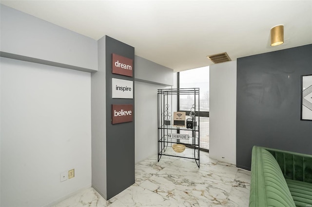 1523 S 10th St Unit 207, Saint Louis, MO 63101 - corridor featuring marble finish floors and expansive windows