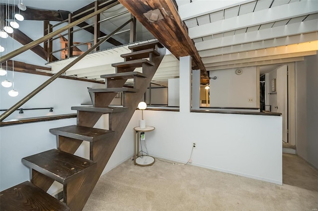 1523 S 10th St Unit 207, Saint Louis, MO 63101 - stairs with carpet, baseboards, and beamed ceiling
