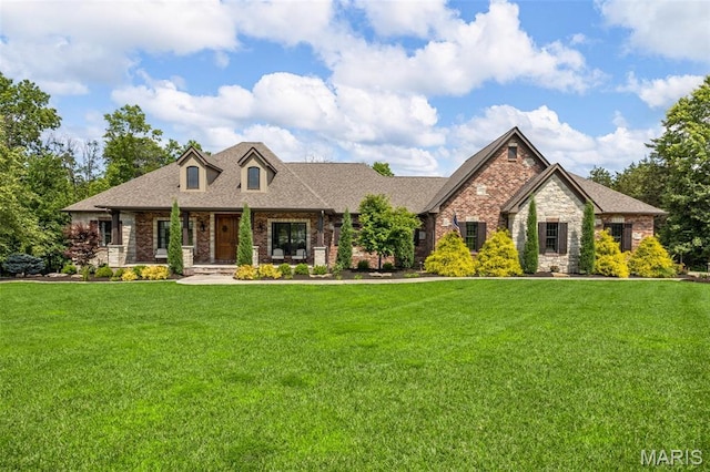 130 Foristell Ridge Ct, Foristell, MO 63348 - craftsman inspired home with a front yard, stone siding, brick siding, and covered porch
