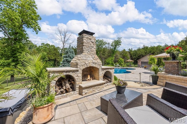 130 Foristell Ridge Ct, Foristell, MO 63348 - view of patio / terrace with an outdoor stone fireplace