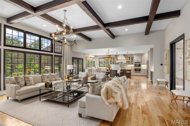 130 Foristell Ridge Ct, Foristell, MO 63348 - living area featuring a chandelier, coffered ceiling, light wood-style flooring, healthy amount of natural light, and beam ceiling