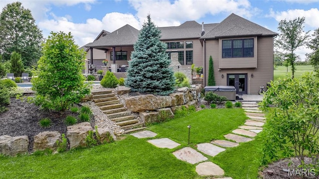 130 Foristell Ridge Ct, Foristell, MO 63348 - back of house featuring a hot tub, a yard, stairway, and french doors