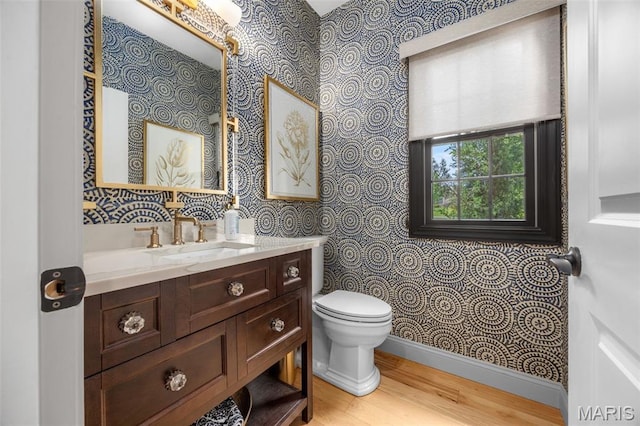 130 Foristell Ridge Ct, Foristell, MO 63348 - bathroom with wallpapered walls, vanity, and wood finished floors
