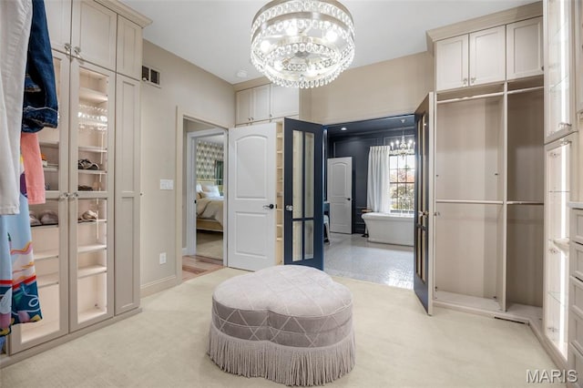 130 Foristell Ridge Ct, Foristell, MO 63348 - spacious closet featuring a chandelier and light carpet
