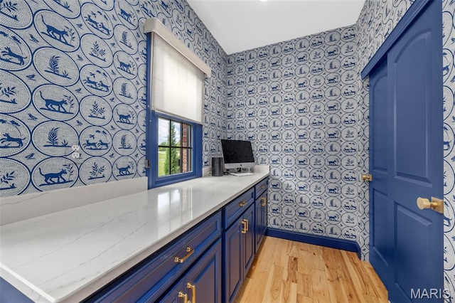 130 Foristell Ridge Ct, Foristell, MO 63348 - bar with wallpapered walls and light wood finished floors