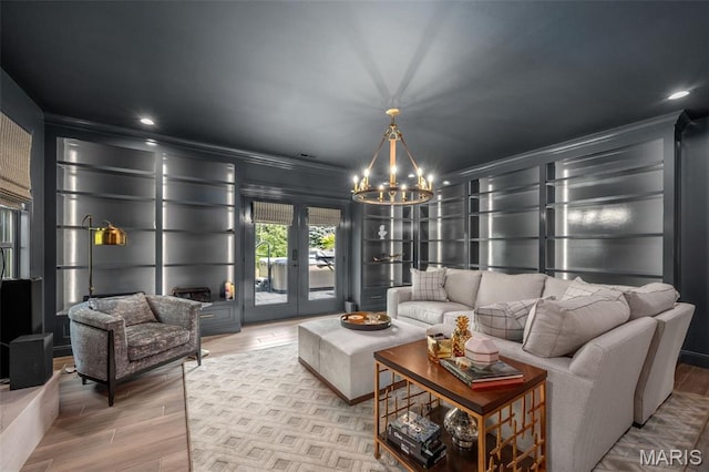 130 Foristell Ridge Ct, Foristell, MO 63348 - living area with a chandelier, crown molding, wood finished floors, french doors, and recessed lighting