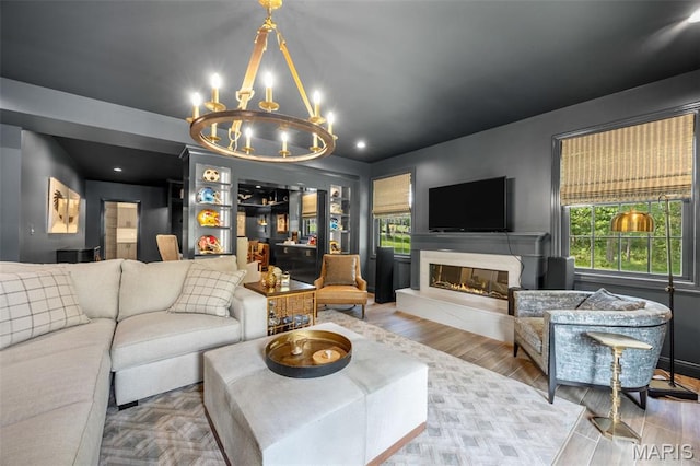 130 Foristell Ridge Ct, Foristell, MO 63348 - living room with a chandelier, a high end fireplace, wood finished floors, and recessed lighting