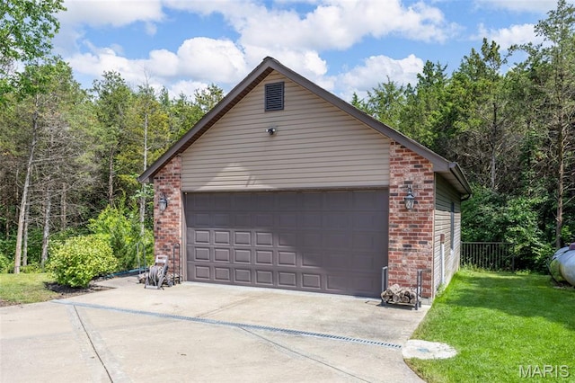 130 Foristell Ridge Ct, Foristell, MO 63348 - garage with driveway and a wooded view